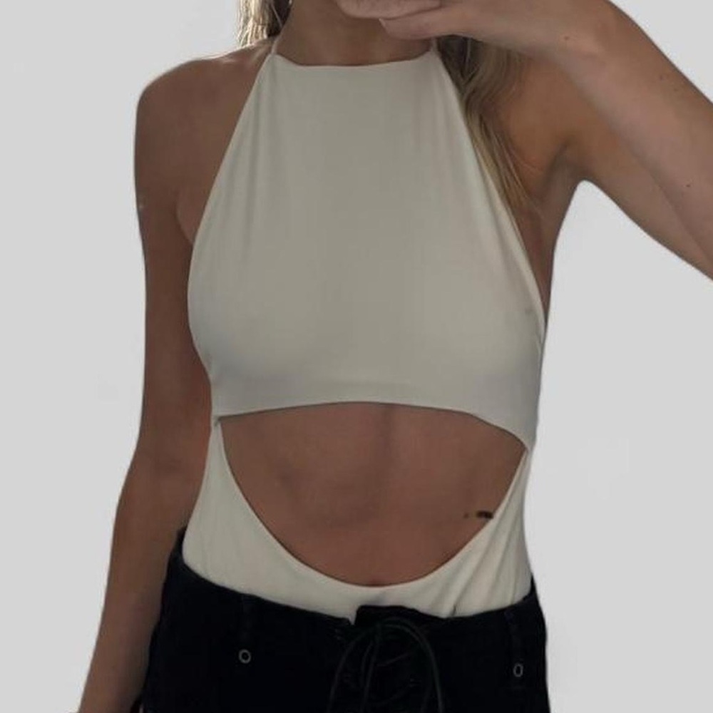 White strappy bodysuit with cut outs and adjustable straps